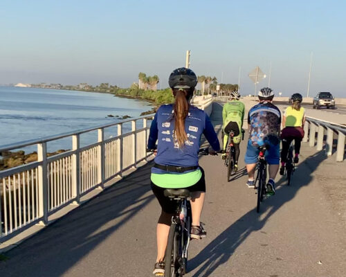 Bicyclists crossing a bridge